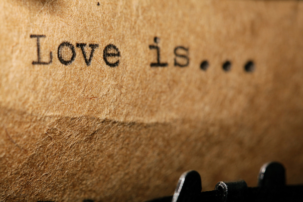 love is, the inscription on a typewriter